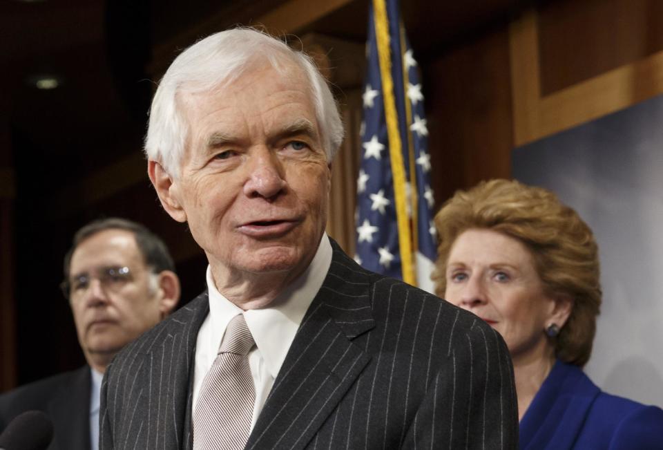 FILE - This Feb. 4, 2014 file photo shows Sen. Thad Cochran, R-Miss, center, speaking during a news conference on Capitol Hill in Washington. Republicans in the 2014 midterm elections can’t seem to reach an official party line on that the old Washington practice of writing the federal budget to benefit the folks back home. Sure, top Republicans like Kentucky Sen. Mitch McConnell _ now Senate minority leader _ and Cochran begrudgingly banned so-called earmarks more than three years ago. They were reacting both to the tea party’s rise and a push from conservative House Republicans like Georgia Rep. Jack Kingston, now a House Appropriations subcommittee chairman. Cochran is flanked by Sen. John Boozman, R-Ark., left, and Debbie Stabenow, D-Mich. (AP Photo/J. Scott Applewhite, File)