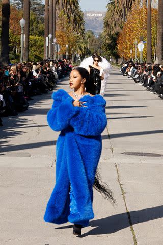 <p>Taylor Hill/Getty </p> Cardi B walks the runway down South Windsor Boulevard during the Balenciaga Fall 2024 fashion show in L.A.