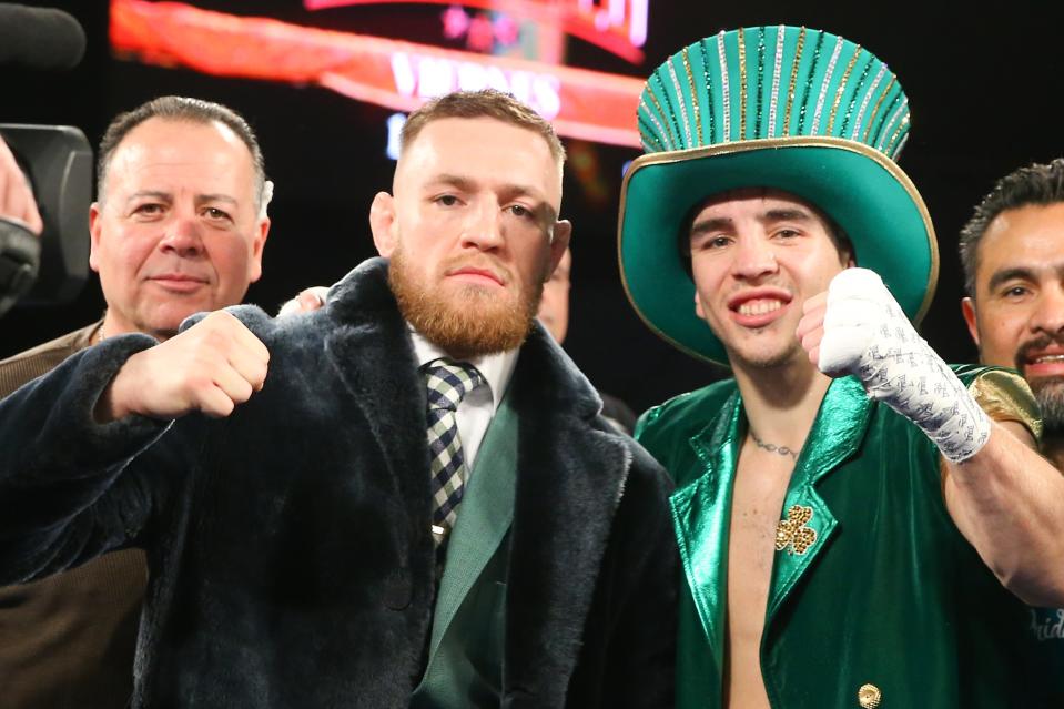 Conor McGregor and Michael Conlan celebrate Conlan’s TKO win over Tim Ibarra after a super bantamweight bout at The Theater at Madison Square Garden on March 17, 2017, in New York. (Getty Images)