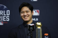 Shohei Ohtani wins the Commissioner's Historic Achievement Award from Rob Manfred before Game 1 in baseball's World Series between the Houston Astros and the Atlanta Braves Tuesday, Oct. 26, 2021, in Houston. (AP Photo/Ashley Landis)