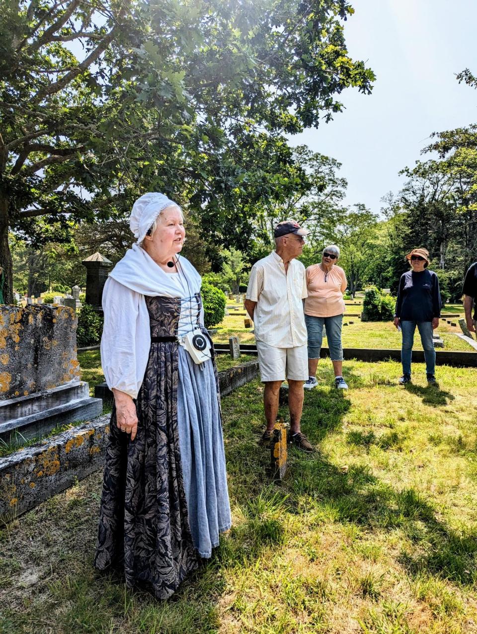 Local historian Terri Fox guides visitors on a one-hour walk through Dennis Village Cemetery.