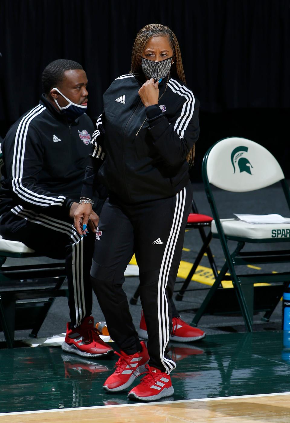 Detroit coach AnnMarie Gilbert walks the sideline against Michigan State, Wednesday, Dec. 2, 2020, in East Lansing, Mich. Michigan State won 82-45.