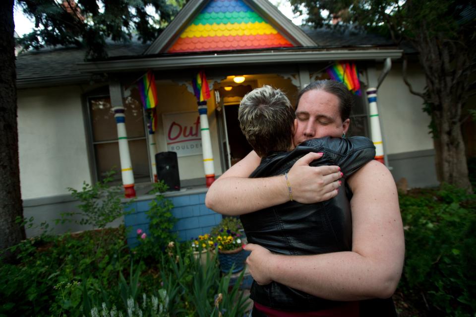 <p>Sara Connell, education and services manager for Out Boulder, hugs Leslie McCormick during a vigil in Boulder, Colo., for the victims of the mass shooting in Orlando, Fla., June 12, 2016. (Autumn Parry/Daily Camera via AP) </p>