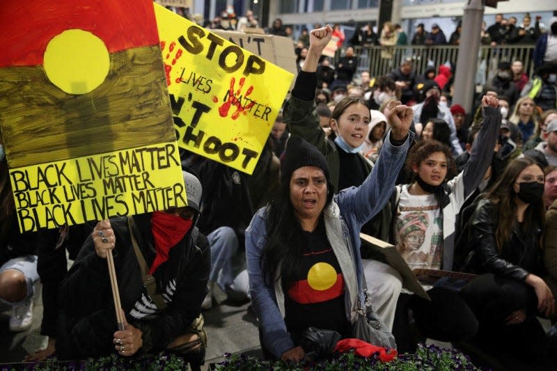 People protest in solidarity with those in the United States protesting police brutality and the death in Minneapolis police custody of George Floyd, in Sydney, Australia, June 2, 2020. REUTERS/Loren Elliott