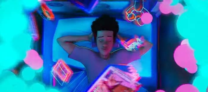 Miles lying on his bed, listening to music with his headphones, when a portal appears above him in "Spider-Man: Across the Spider-Verse (Part One)"