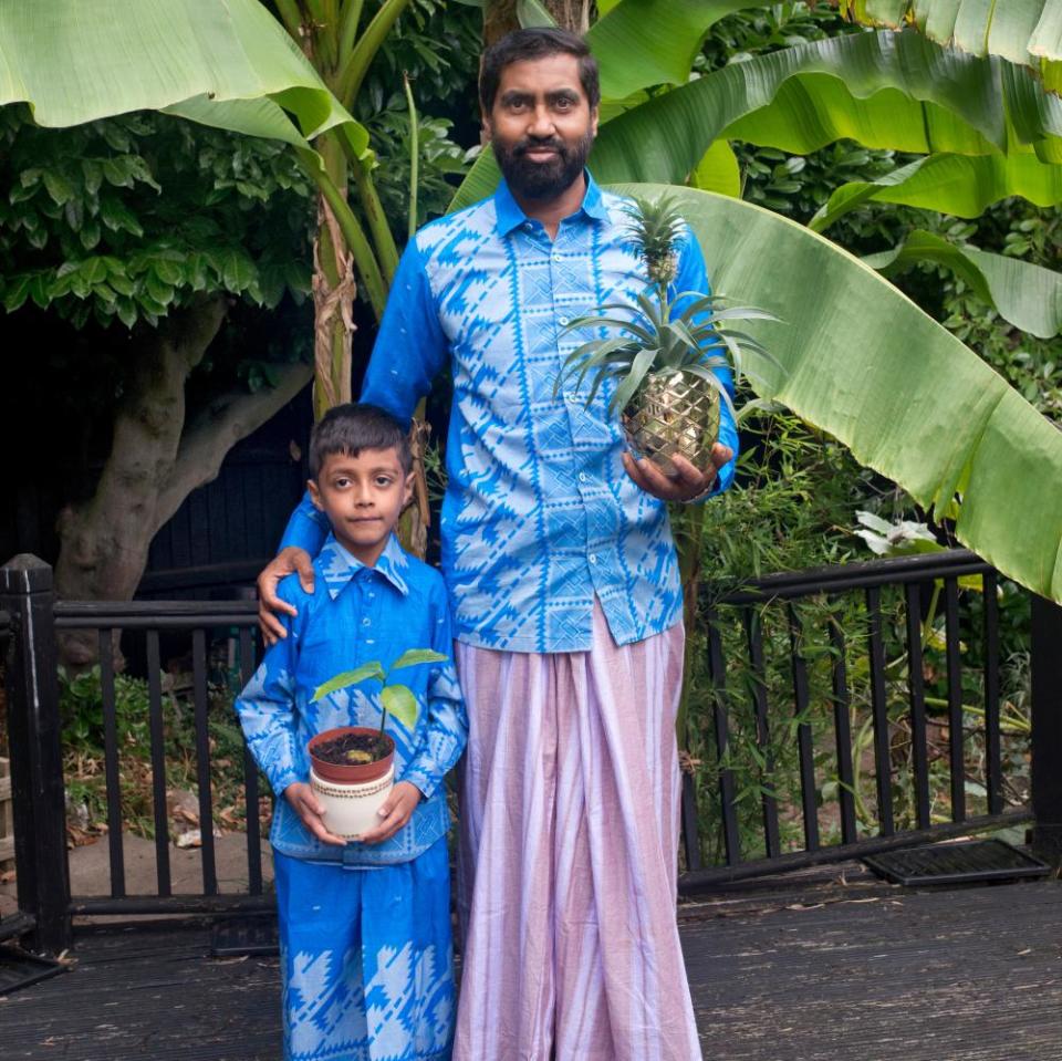 Azad Ali with son Yaqub and some of his tropical fruit experiments