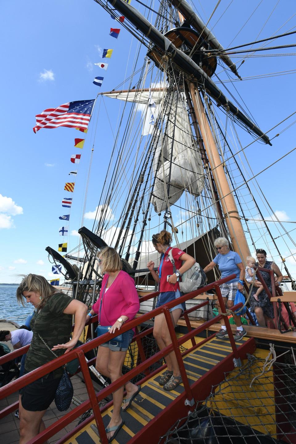 Spectators exit the U.S. Brig Niagara, docked Aug. 23, 2019, at Dobbins Landing on Presque Isle Bay in Erie. The tall ship was one of the featured attractions of the 2019 Tall Ships Erie festival. 