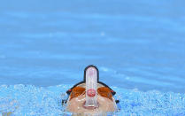 Swimmer Hayley Palmer of New Zealand trains at the Aquatics Centre in the Olympic Park in Stratford in east London July 24, 2012. REUTERS/Toby Melville (BRITAIN - Tags: SPORT SWIMMING OLYMPICS)