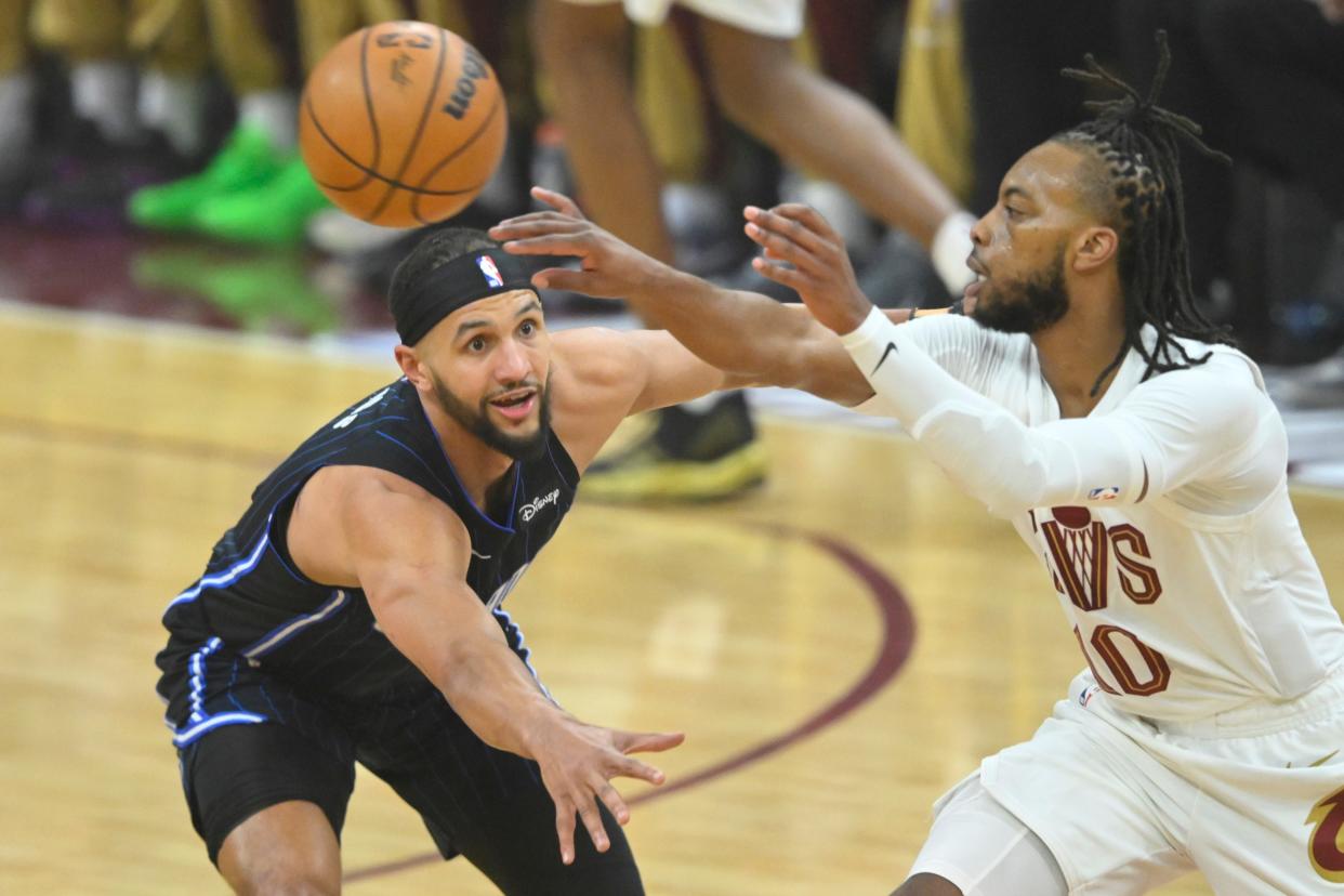 Apr 20, 2024; Cleveland, Ohio, USA; Orlando Magic guard Jalen Suggs (4) defends Cleveland Cavaliers guard Darius Garland (10) in the first quarter during game one of the first round for the 2024 NBA playoffs at Rocket Mortgage FieldHouse. Mandatory Credit: David Richard-USA TODAY Sports