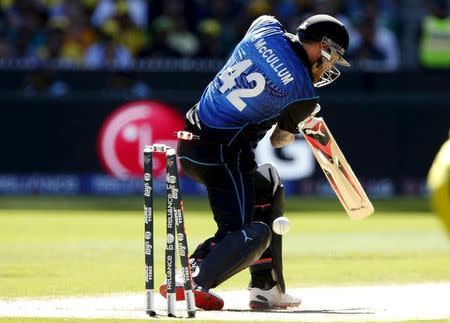 New Zealand's captain Brendon McCullum is bowled for a duck by Australia's Mitchell Starc during their Cricket World Cup final match at the Melbourne Cricket Ground (MCG) March 29, 2015. REUTERS/Brandon Malone