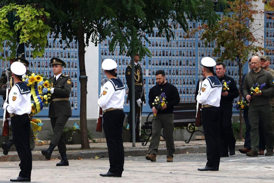Ukraine's President Volodymyr Zelensky visits the Memory Wall of Fallen Defenders of Ukraine to mark Defenders Day of Ukraine in Kyiv on October 1, 2023.