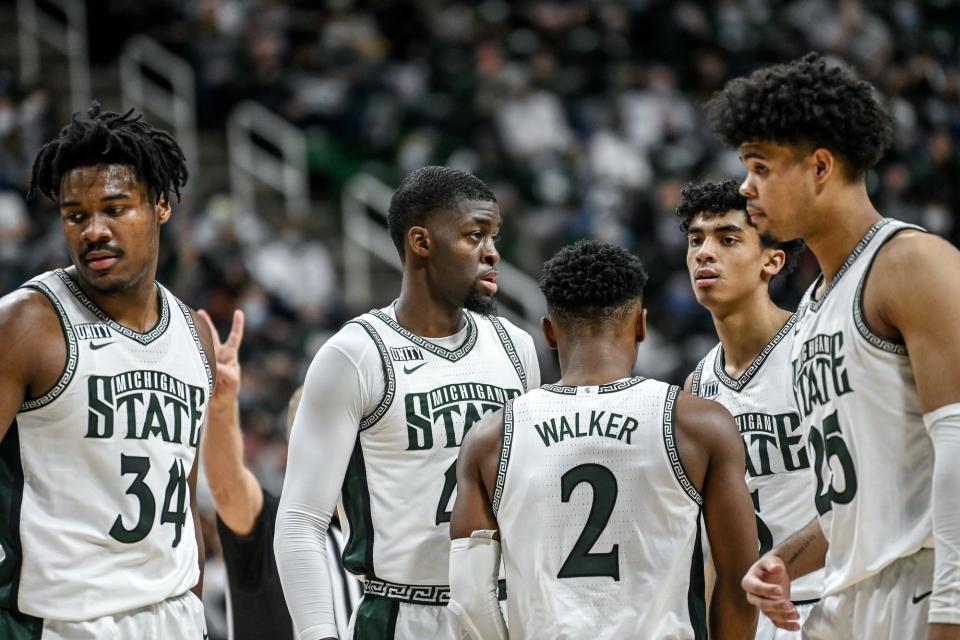 From left,  Michigan State's Julius Marble II, Gabe Brown, Tyson Walker, Max Christie and Malik Hall look on during a break in the action against Northwestern in the second half on Saturday, Jan. 15, 2022, at the Breslin Center in East Lansing.