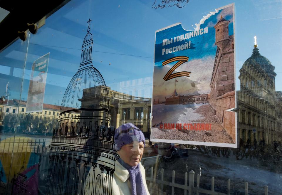 "Z" has become a symbol of support for Russian military action in Ukraine. A poster at a bus stop in central St. Petersburg reads, "We are proud of Russia! We are not ashamed!"