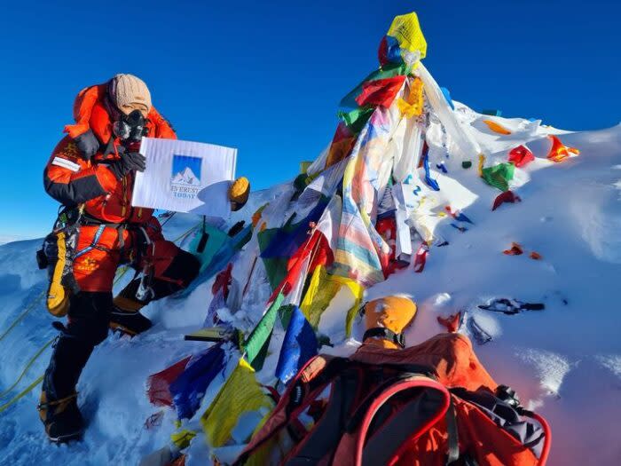 Climber with O2 mask on top of Everest