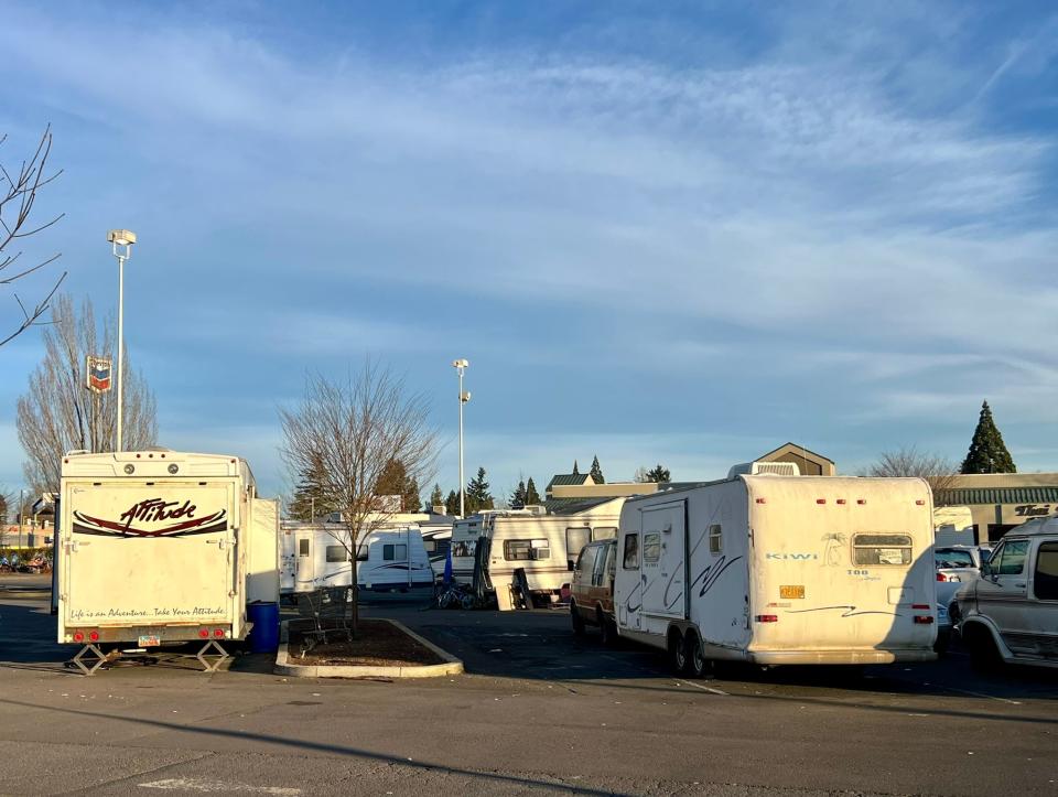 RVs camping in a parking lot March 15 in the 1200 block of Lancaster Drive NE near Coastal Farm & Ranch and WinCo Foods.