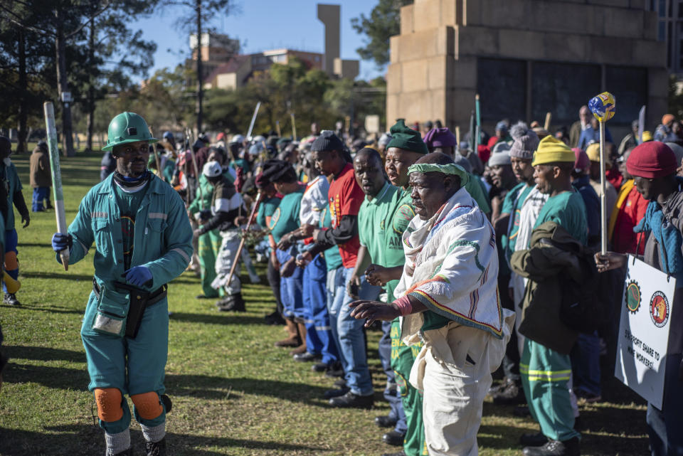 Striking miners protest for higher wages at the Union Buildings, in Pretoria, South Africa, Tuesday, May 24, 2022 as South African President Cyril Ramaphosa receives German Chancellor Olaf Scholz. (AP Photo)