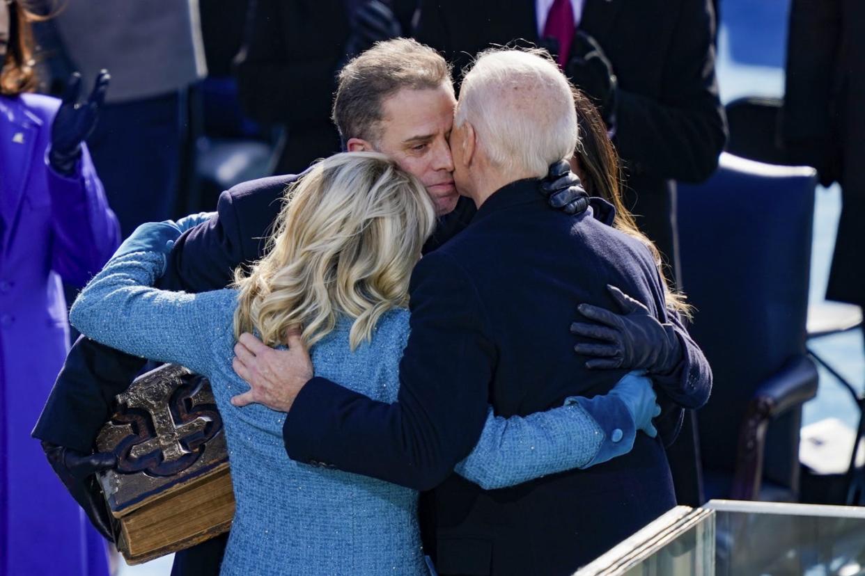 Hunter Biden embraces his father, President Joe Biden, and his stepmother, Jill, at Biden's 2021 inauguration. <a href="https://media.gettyimages.com/id/1297458688/photo/joe-biden-sworn-in-as-46th-president-of-the-united-states-at-u-s-capitol-inauguration-ceremony.jpg?s=1024x1024&w=gi&k=20&c=L6V8L9WBm5riCvN0sNvEwecKJKpOJbqg9BMAPZd6gYk=" rel="nofollow noopener" target="_blank" data-ylk="slk:Drew Angerer/Getty Images;elm:context_link;itc:0;sec:content-canvas" class="link ">Drew Angerer/Getty Images</a>
