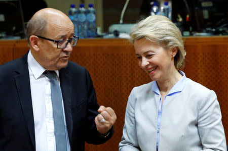 France's Defence Minister Jean-Yves Le Drian (L) and his German counterpart Ursula von der Leyen attend a European Union foreign and defence ministers meeting in Brussels, Belgium November 14, 2016. REUTERS/Yves Herman