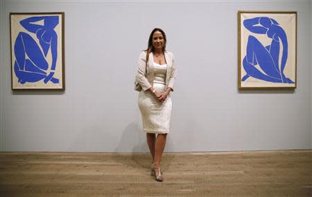 Sophie Matisse, great granddaughter of Henri Matisse, poses with his artwork "Blue Nude III" (Nu Bleu III) (L) and "Blue Nude II" (Nu Bleu II) at the Tate Modern gallery in London April 14, 2014. REUTERS/Luke MacGregor