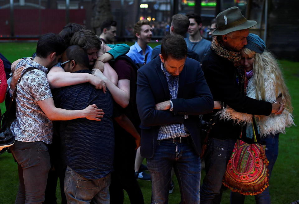 Mourners embrace during a vigil, in memory of the victims of the gay nightclub mass shooting in Orlando, at St Anne's Church in the Soho district of London, Britain June 13, 2016.&nbsp;