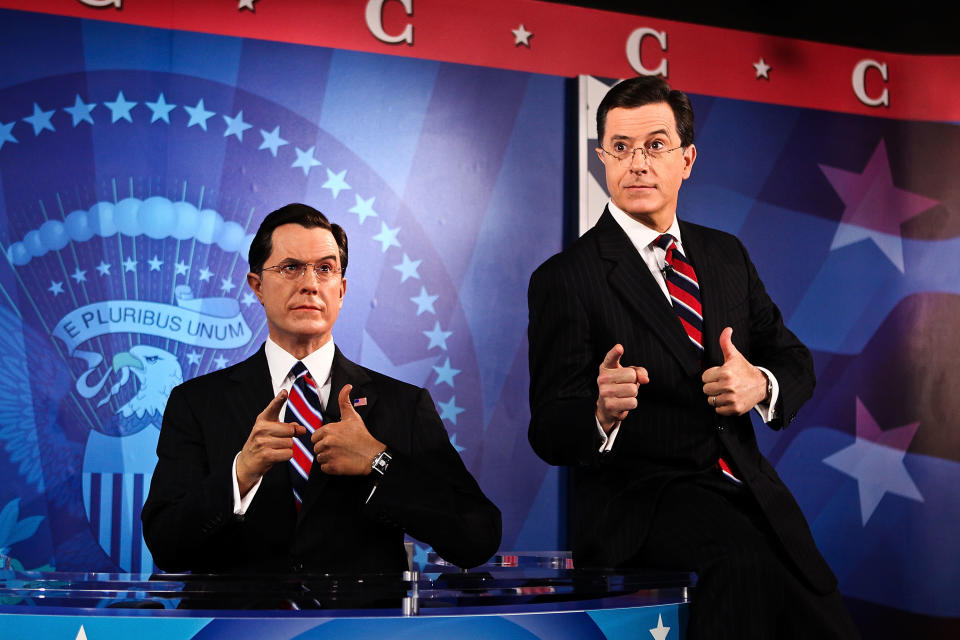Stephan Colbert poses for photos with his wax figure at the Stephen Colbert wax figure unveiling at Madame Tussauds on November 16, 2012 in Washington, DC. (Photo by Paul Morigi/WireImage)