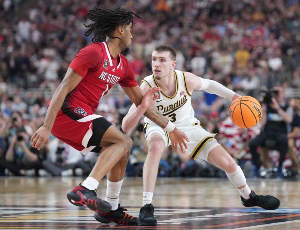 North Carolina State Wolfpack guard Jayden Taylor (1) defends Purdue Boilermakers guard Braden Smith (3) during the NCAA Men’s Basketball Tournament Final Four game, Saturday, April 6, 2024, at State Farm Stadium in Glendale, Ariz.
