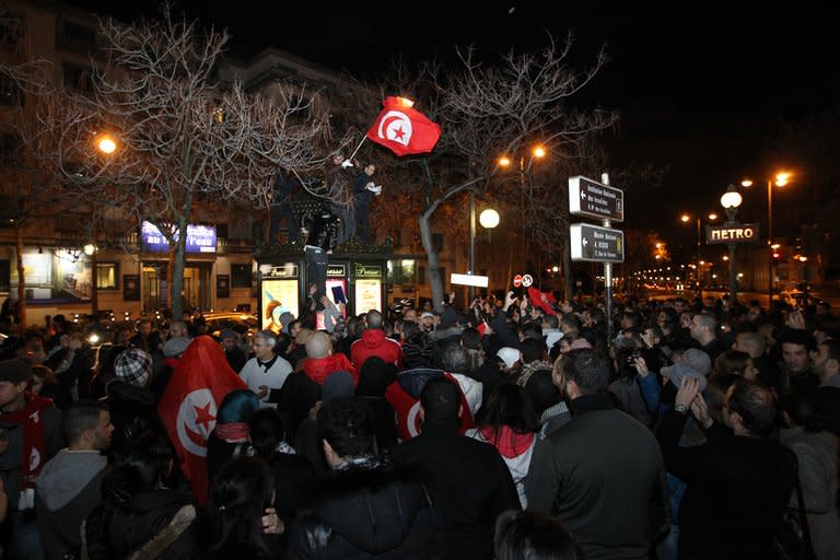 People celebrate on January 14, 2011 near the Tunisian embassy in Paris, after the announcement that Tunisia's fallen president Zine El Abidine Ben Ali had quit Tunisia after weeks of deadly protests. There were some successes for democracy in 2012, with the most dramatic improvements since 2008 seen in Libya, Tunisia and Myanmar, a study said