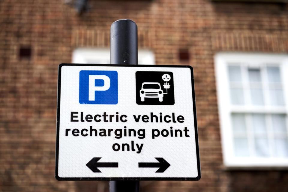 Electric vehicle signage at a Source London EV charging station in central London (John Walton/PA) (PA Archive)