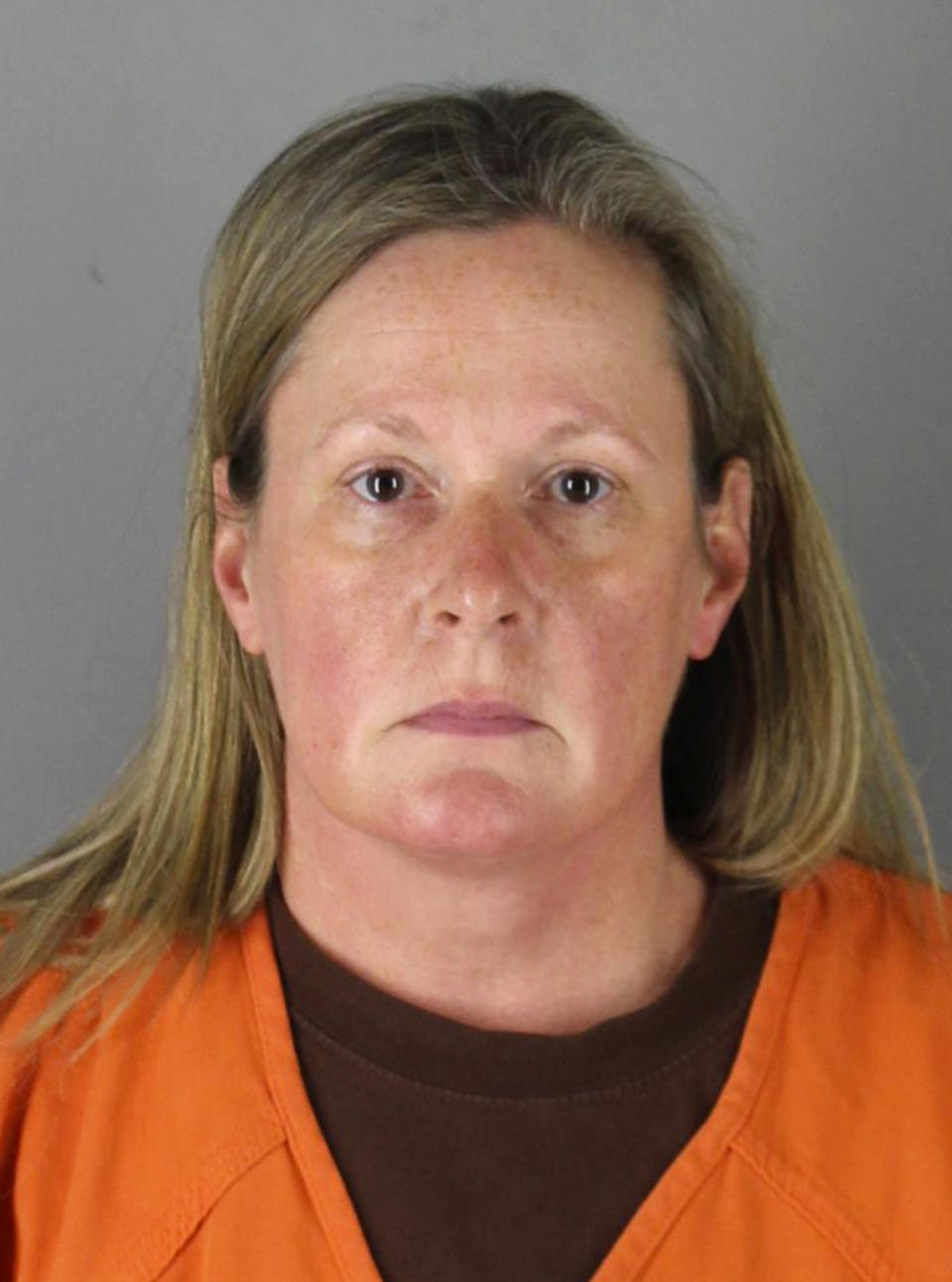 This booking photo released by the Hennepin County, Minn., Sheriff shows Kim Potter, a former Brooklyn Center, Minn., police officer who is charged Wednesday, April 14, 2021, with second-degree manslaughter for killing 20-year-old Black motorist Daunte Wright in a shooting that ignited days of unrest and clashes between protesters and police. (Hennepin County Sheriff via AP)