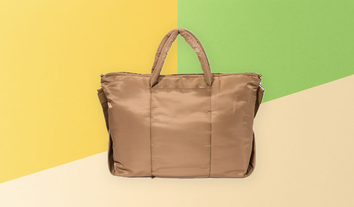 Target weekender bag against yellow and green background
