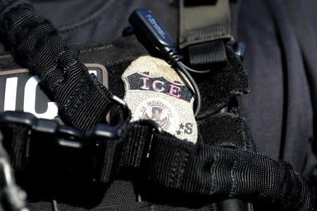 The badge of a U.S. Immigration and Customs Enforcement's (ICE) Fugitive Operations team is seen in Santa Ana, California, U.S., May 11, 2017. REUTERS/Lucy Nicholson