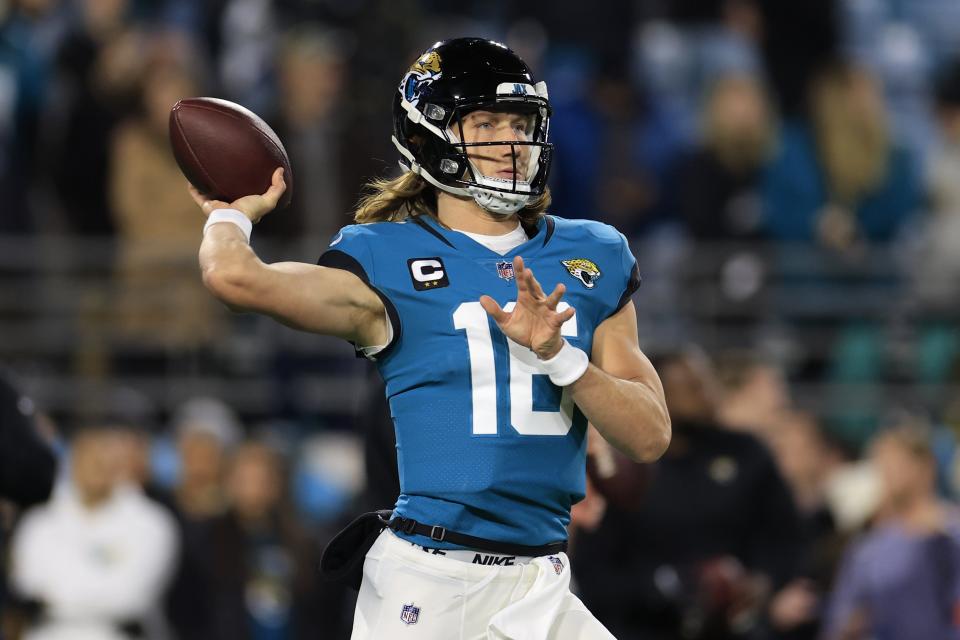 Jaguars quarterback Trevor Lawrence (16) looks to pass during the first-round playoff game against the Chargers.