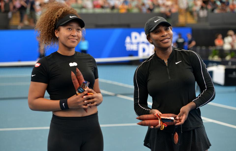 Serena Williams (pictured right) and Naomi Osaka (pictured left) pose for pictures before their women's singles match at the 'A Day at the Drive' exhibition tennis tournament in Adelaide.