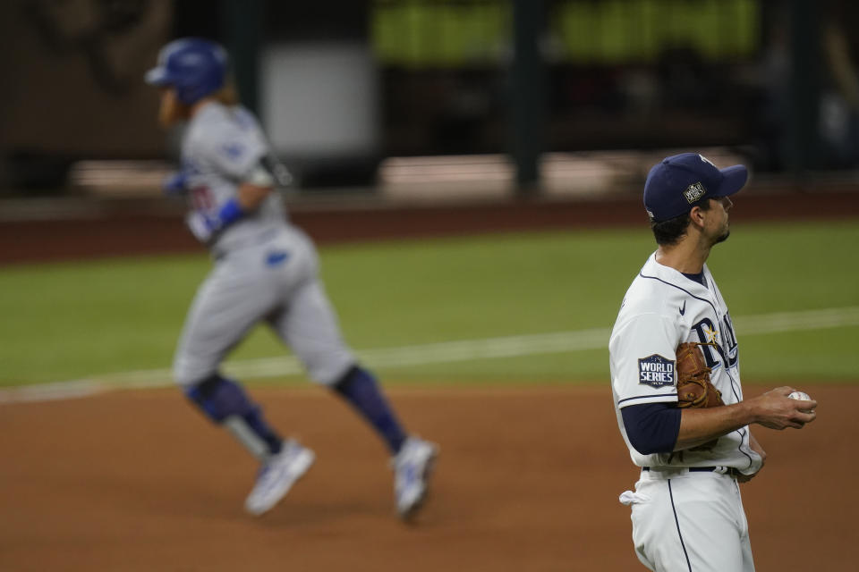 Los Angeles Dodgers' Justin Turner rounds the bases after a home run off Tampa Bay Rays starting pitcher Charlie Morton during the first inning in Game 3 of the baseball World Series Friday, Oct. 23, 2020, in Arlington, Texas. (AP Photo/Eric Gay)