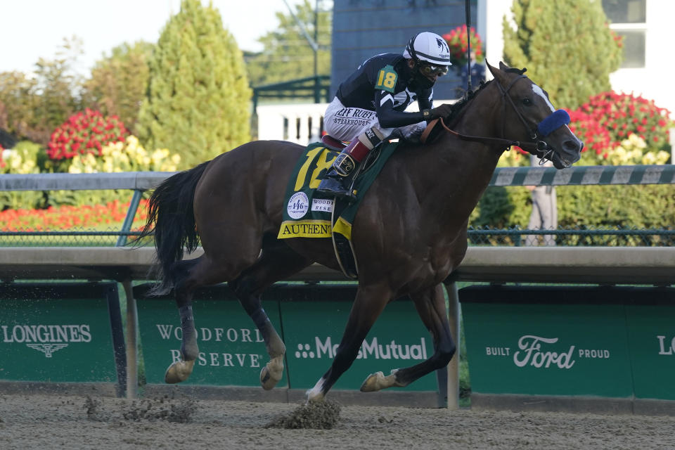 FILE - In this Sept. 5, 2020, file photo, jockey John Velazquez rides Authentic to the finish line to win the 146th running of the Kentucky Derby at Churchill Downs in Louisville, Ky. Kentucky Derby winner Authentic heads a field of 11 horses, possibly including filly and Preakness winner Swiss Skydiver against males, for the Breeders’ Cup Classic, with trainer Bob Baffert entering three horses in the $6 million race that includes Belmont winner Tiz the Law. (AP Photo/Darron Cummings, File)