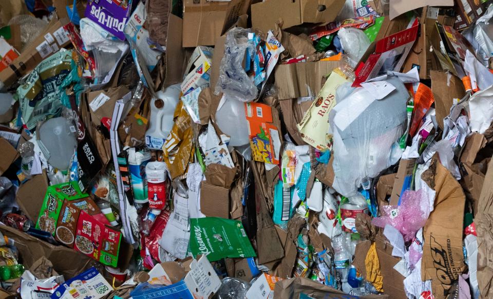 A pile of recyclable materials sits awaiting sorting, Tuesday, March 26, 2024, at the Tippecanoe County Solid Waste District in Lafayette, Ind.