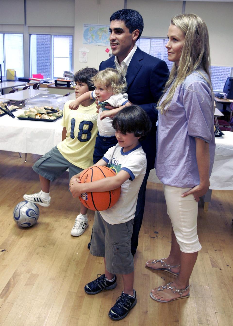 FILE - New York Red Bulls midfielder Claudio Reyna, top center, and his wife, Danielle, right, pose with their sons, Jack, 9, Joah, 17 months, and Giovanni, 5, from left, before a news conference in Newark, N.J., July 16, 2008, to announce Reyna's retirement from soccer. The U.S. men's soccer team was plunged into public turmoil Wednesday, Jan. 4, 2023, when the Reyna family said it notified the U.S. Soccer Federation of a decades-old incident involving Gregg Berhalter and his wife in response to the coach’s disparagement of young star Gio Reyna. (AP Photo/Mike Derer, File)