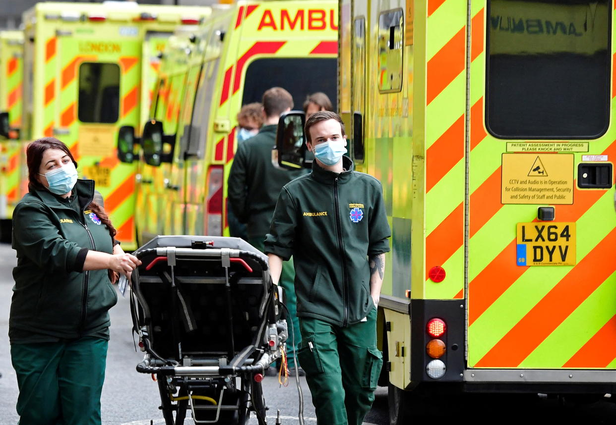 Health workers move equipment between ambulances outside of the Royal London Hospital, amid the coronavirus disease (COVID-19) pandemic in London, Britain, January 7, 2022. REUTERS/Toby Melville