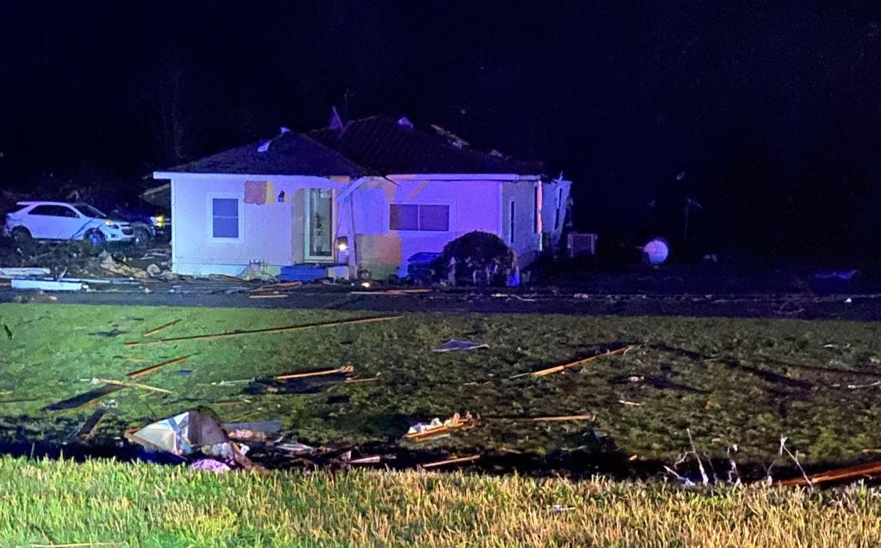 Destruction and emergency services at the scene after tornadoes tore through the US state of Mississippi - MISSISSIPPI HIGHWAY PATROL HANDOUT/EPA-EFE/Shutterstock