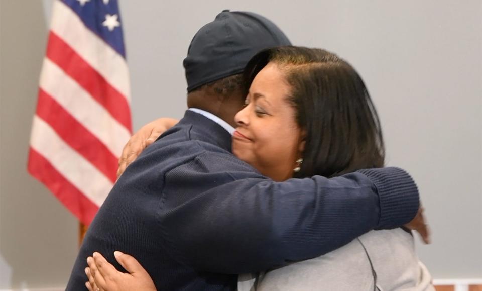 Superintendent Andrea Berry, right, hug president of the school board Michael Breeland while crossing paths to the podium after the announcement Thursday.