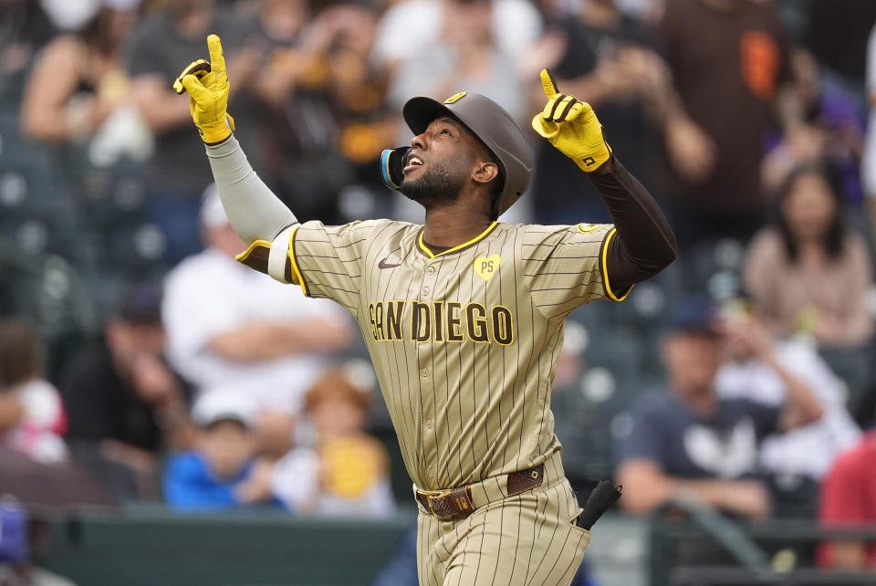 San Diego Padres' Jurickson Profar gestures as he circles the bases after hitting a two-run home run off Colorado Rockies relief pitcher Nick Mears in the seventh inning of a baseball game Thursday, April 25, 2024, in Denver. (AP Photo/David Zalubowski)