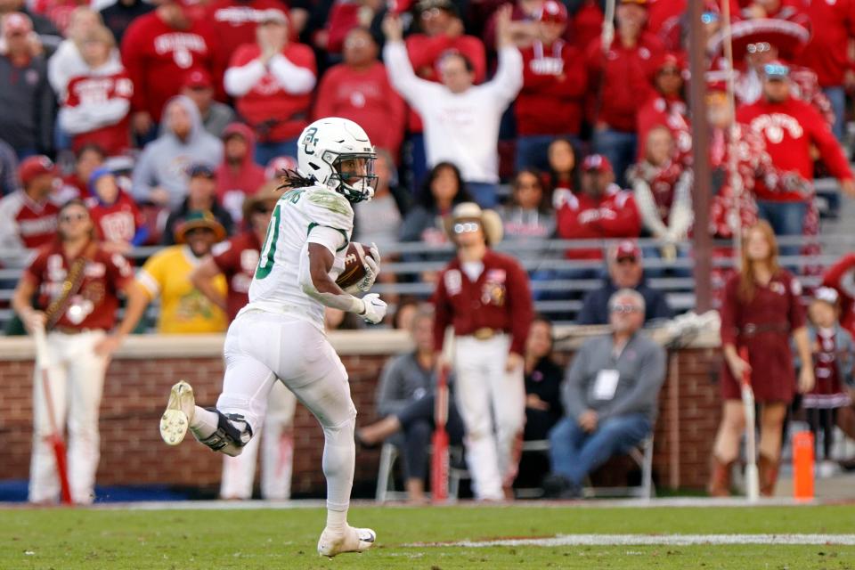 Baylor running back Craig "Sqwirl" Williams breaks a long run before intentionally stopping at the OU 7-yard line late in a 38-35 win Saturday in Norman.