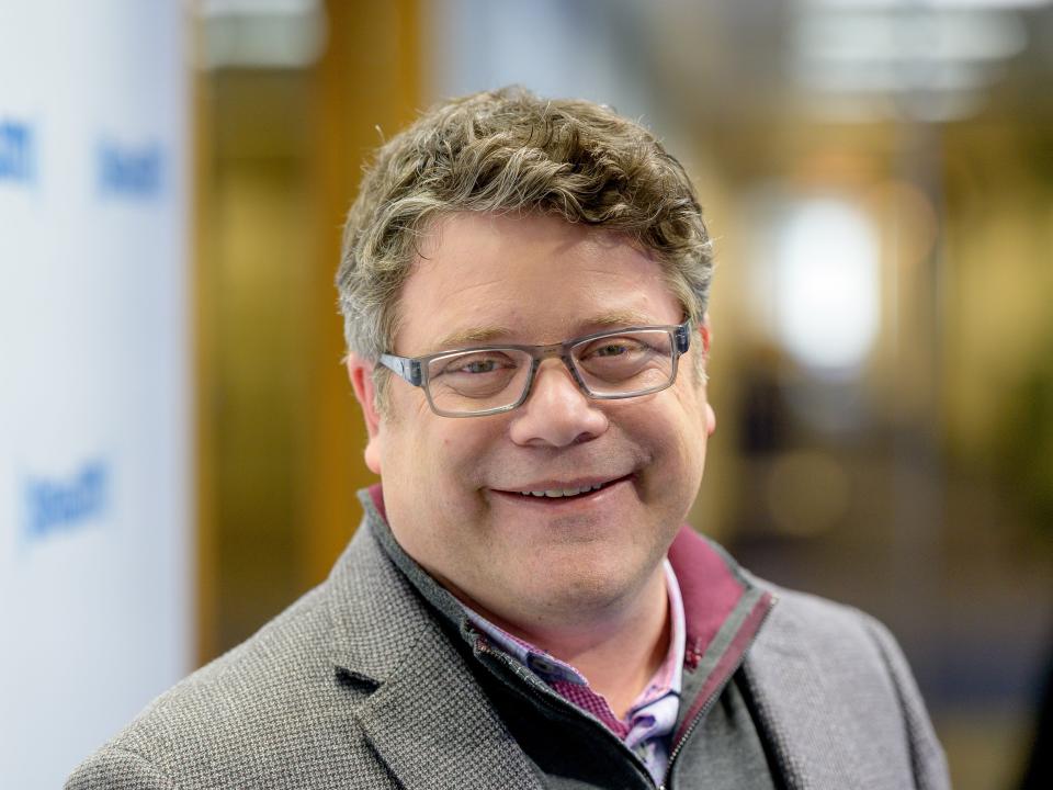 Sean Astin wearing a gray blazer