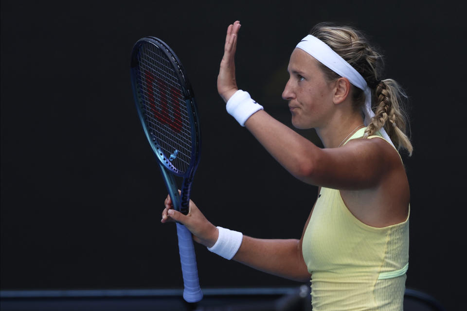 Victoria Azarenka of Belarus waves after defeating Camila Giorgi of Italy in their first round match at the Australian Open tennis championships at Melbourne Park, Melbourne, Australia, Tuesday, Jan. 16, 2024. (AP Photo/Asanka Brendon Ratnayake)