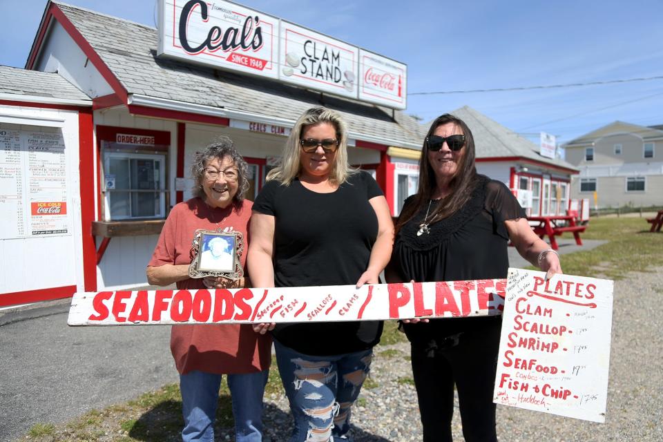 Florence Littlefield Henderson, left, her granddaughter Alison Tirone and her daughter Debbie Henderson-Bembury in front of Ceal's Clam Stand Wednesday, June 15, 2022, in Seabrook.