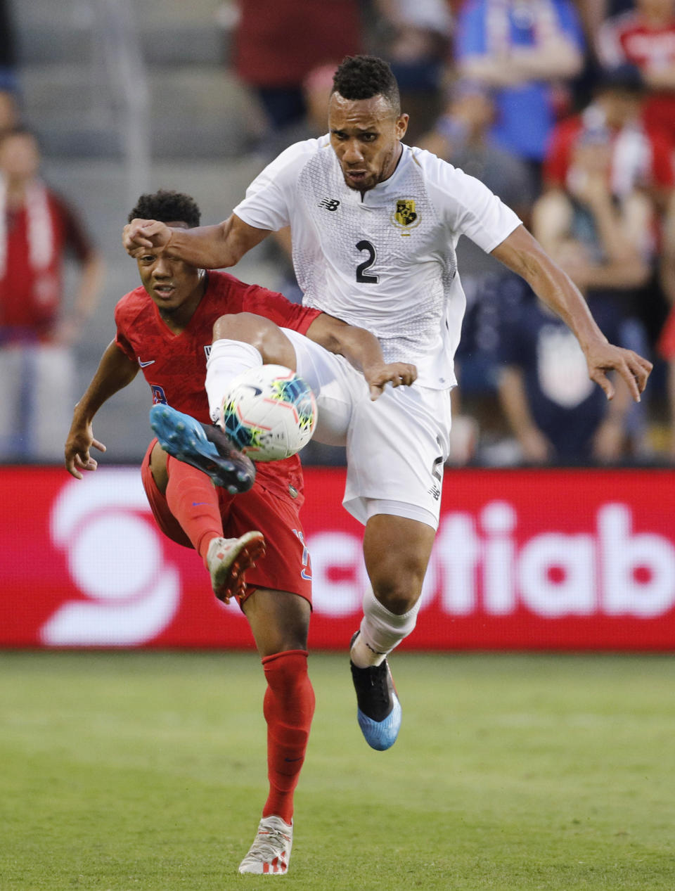 U.S. forward Jonathan Lewis (18) and Panama defender Francisco Palacios (2) viefor the ball during the first half of a CONCACAF Gold Cup soccer match in Kansas City, Kan., Wednesday, June 26, 2019. (AP Photo/Colin E. Braley)