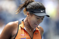 Naomi Osaka, of Japan, reacts after losing a point to Anna Blinkova, of Russia, during the first round of the US Open tennis tournament Tuesday, Aug. 27, 2019, in New York. (AP Photo/Michael Owens)
