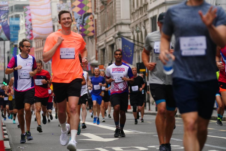 Runners in Piccadilly taking part in the Asics London 10k (Victoria Jones/PA) (PA Wire)