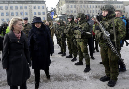 German Defence Minister Ursula von der Leyen (L) and Lithuania's President Dalia Grybauskaite attend a ceremony to welcome the German battalion being deployed to Lithuania as part of NATO deterrence measures against Russia in Rukla, Lithuania February 7, 2017. REUTERS/Ints Kalnins