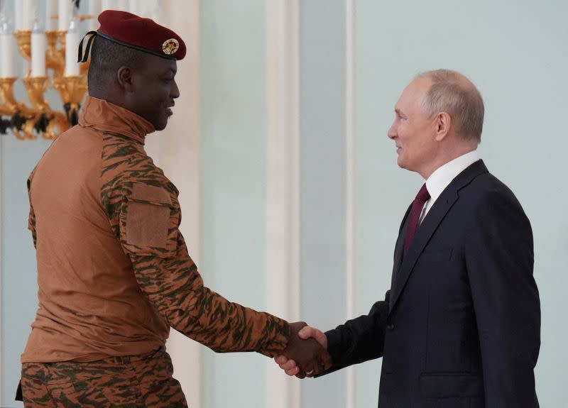 FILE PHOTO: Russia's President Putin and Burkina Faso's interim President Traore meet in St Petersburg